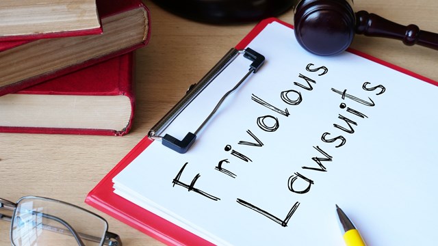 Frivolous lawsuits is shown on a conceptual photo using the text