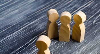 Q&A: This Board’s Gone to the Dogs Three people meet one. Three people are aggressively attuned to one. People conduct an interview and a meeting. The concept of attack, threats, encounters, education. Businessmen stand in a group of three.