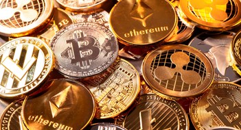 Buying Apartments With Cryptocurrency Frankfurt, Hesse, Germany - April 17, 2018: Many coins of various cryptocurrencies