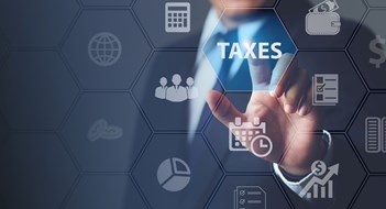 Businessman using innovative virtual touchscreen presses taxes button.with icons state taxes.Data analysis,paperwork,financial research,report.Calculation tax return surrounding.taxes Concept