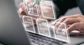 Q&A: A Window Into the Records Businessman working on laptop computer with electronics document icons, E-document management, online documentation database, paperless office concept