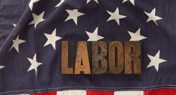 Labor Negotiations Underway with 32BJ the word labor in old letterpress wood type on an old flag