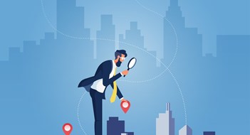 Businessman holding magnifying glass and Building, building selection