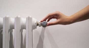 The Myth of Radiator Valves white radiator on a light wall in the room