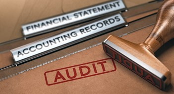 When It’s Time for an Audit Rubber stamp over two folders with the text financial statements, accounting records and the word audit. Concept of financial auditing. 3D illustration.