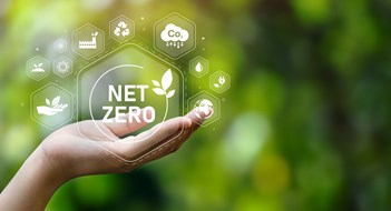 How Your Building Envelope Figures Into Local Law 97 Requirements The concept of carbon neutral and net zero. natural environment A climate-neutral long-term strategy greenhouse gas emissions targets with green net center icon on hand cap and green background