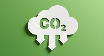 Navigating Building Decarbonization in New York State Reduce CO2 emissions to limit climate change and global warming. Low greenhouse gas levels, decarbonize, net zero carbon dioxide footprint. Abstract minimalist design, cutout paper, green background.