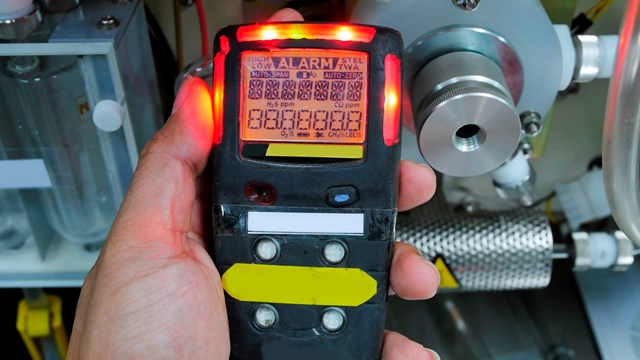 Personal H2S Gas Detector,Check gas leak. Safety concept of safety and security system on offshore oil and gas processing platform, hand hold gas detector for check hydrocarbon leak to protect fire and explosion.