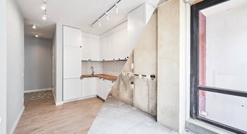 Who's Spending on Home Improvements? Photo collage of apartment before and after restoration or refurbishment. Comparison of old room and new kitchen with parquet floor, doorway, kitchen counter and white walls. Home renovation concept.