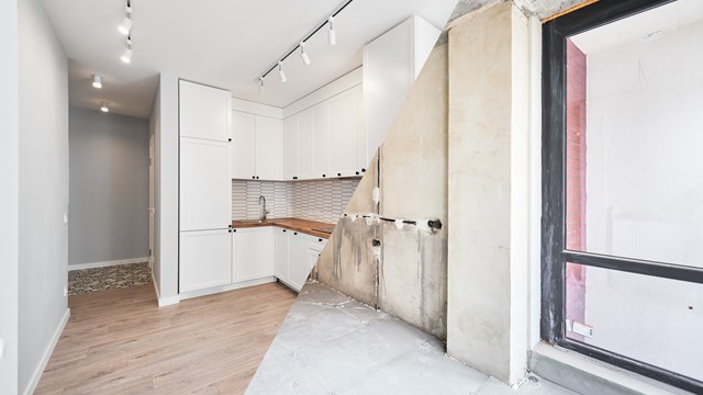 Photo collage of apartment before and after restoration or refurbishment. Comparison of old room and new kitchen with parquet floor, doorway, kitchen counter and white walls. Home renovation concept.