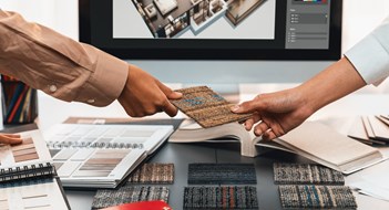 Common Area Design Group of interior architect designer team at table choosing various mood board samples with architecture software on laptop screen. Modern renovation and interior material selection concept. Insight