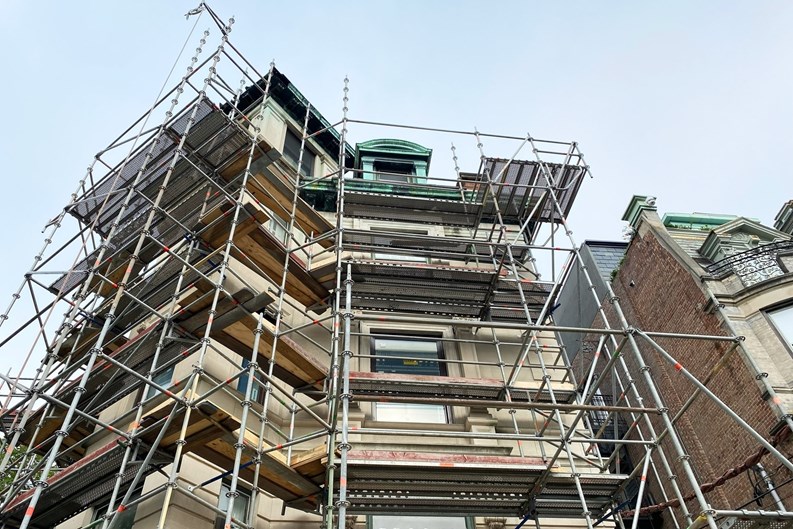 Hoboken, NJ, USA: A meticulous house restoration project featuring a striking brownstone entrance and a stunning building facade renovation.
