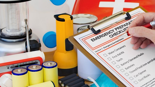 Ready for disaster - checking off the items on the emergency  preparedness form