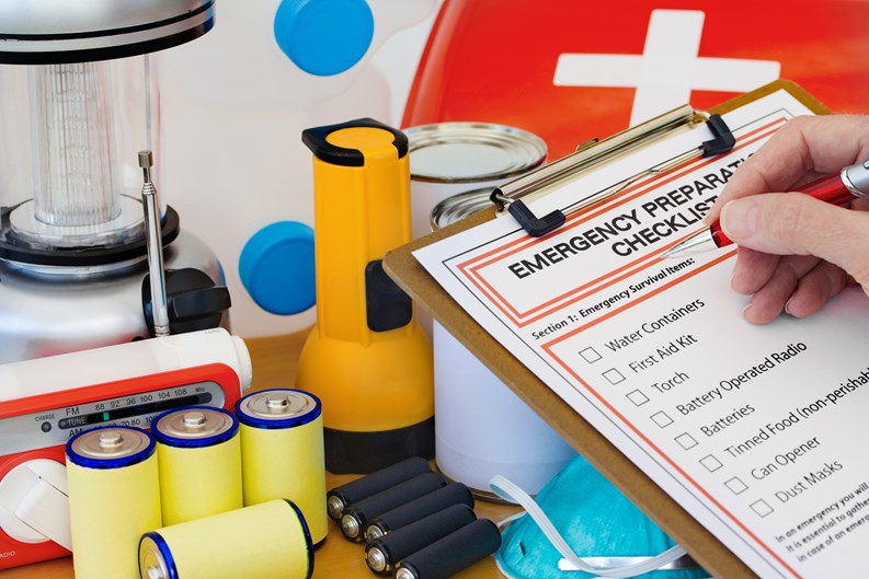 Ready for disaster - checking off the items on the emergency  preparedness form