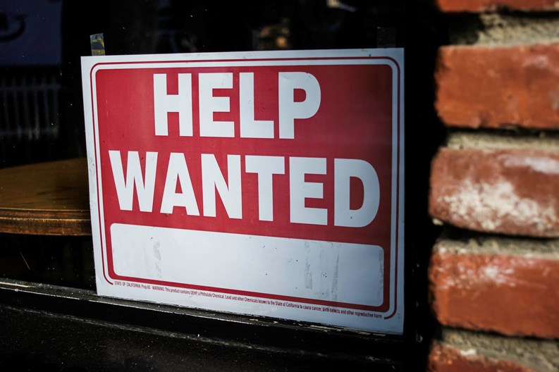 Help wanted sign on business window