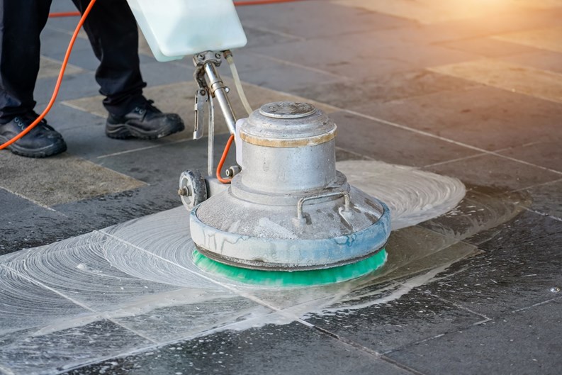 Carpet chemical foaming, rubbing and cleaning with professionally disk machine. Concrete floor regular cleanup. Cleaning service.
