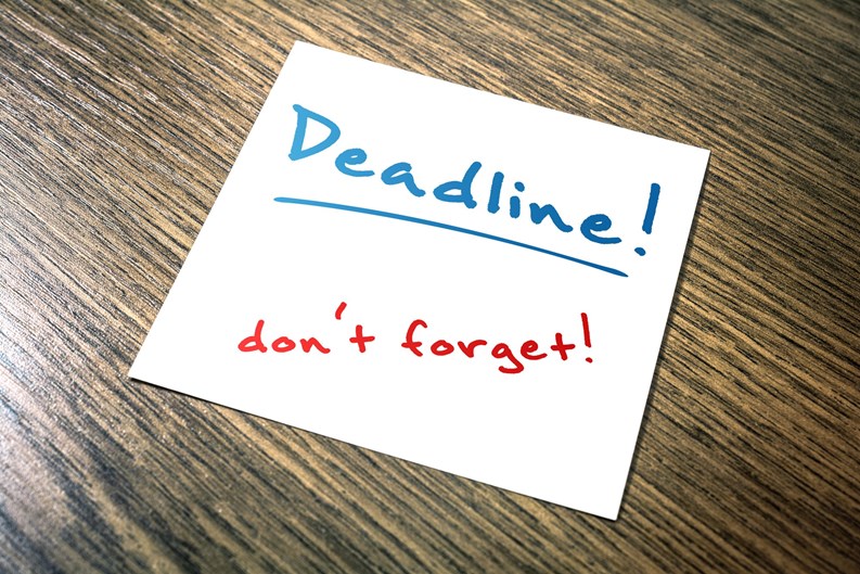 Deadline Reminder On Paper Lying On Wooden Cupboard