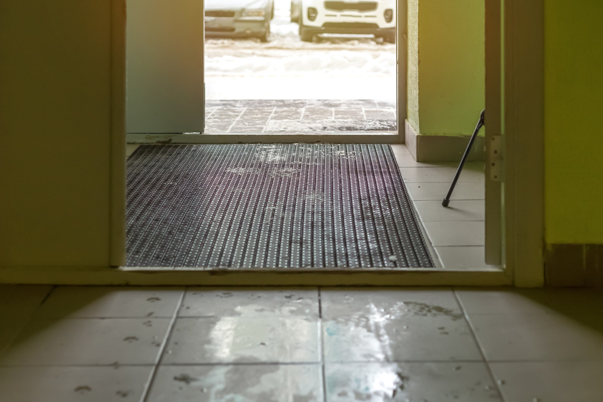 wet and muddy in the stairwell, slush in winter or spring, exit to the street